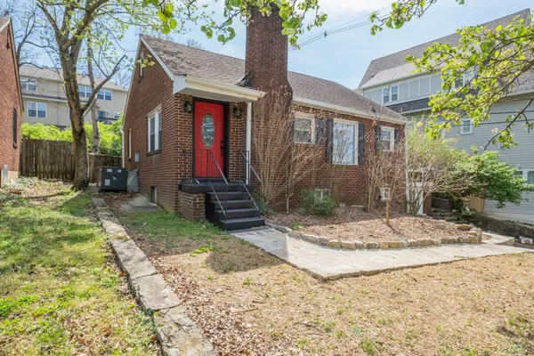 a view of house with yard and outdoor space
