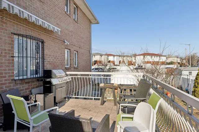 a view of a patio with table and chairs