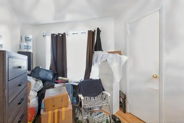 a view of kitchen with furniture and refrigerator
