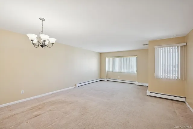 a kitchen with a refrigerator sink stove and cabinets