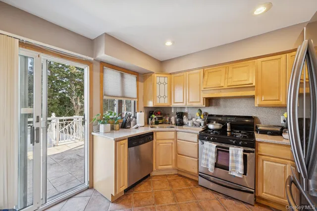 a kitchen with a stove a sink and a refrigerator