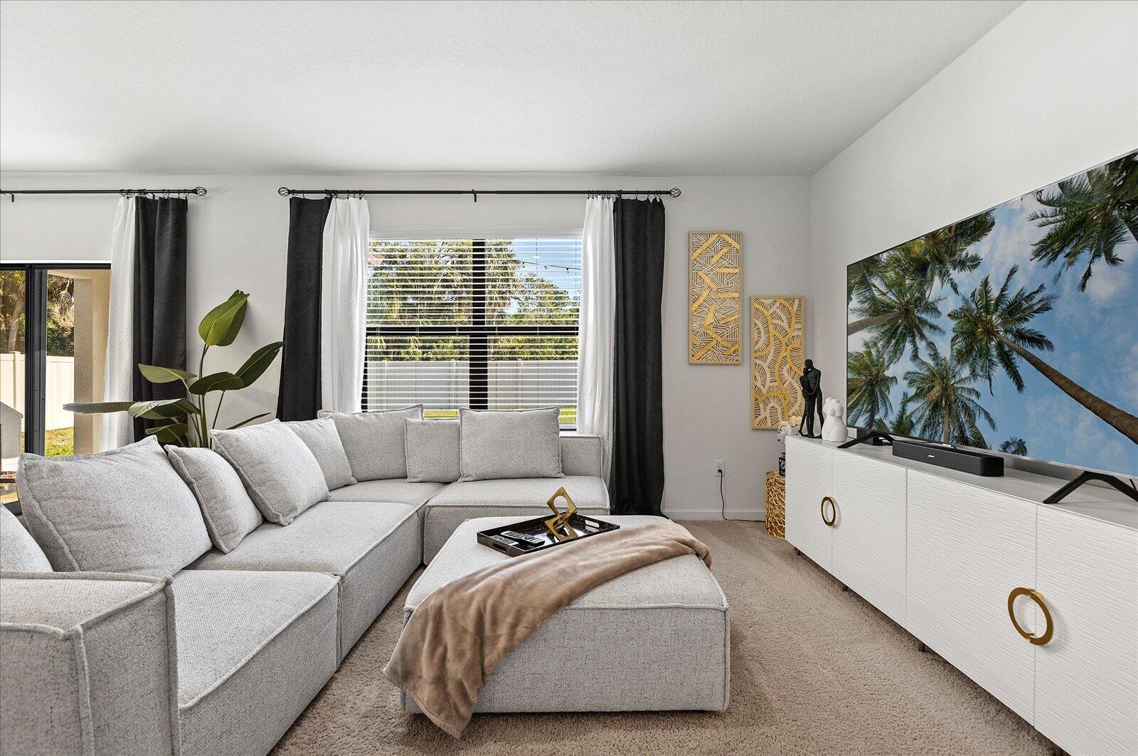 1671 Saxton Road Cocoa, FL 32926 - Photo 12 of 39 a living room with furniture and a large window