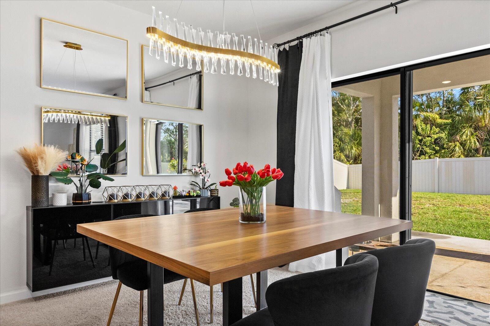 1671 Saxton Road Cocoa, FL 32926 - Photo 13 of 39 a view of a dining room with furniture window and wooden floor