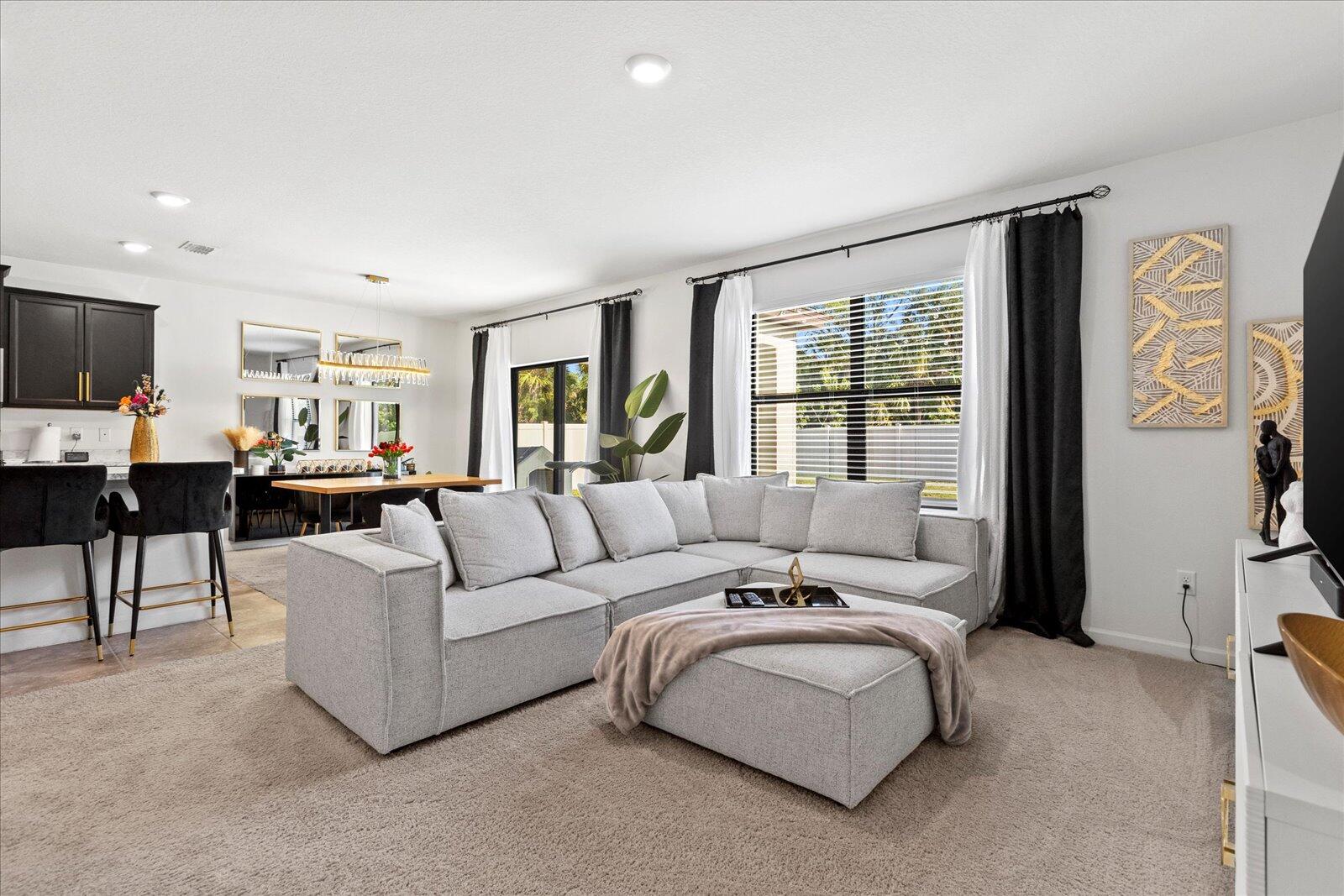 1671 Saxton Road Cocoa, FL 32926 - Photo 16 of 39 a living room with furniture and a large window