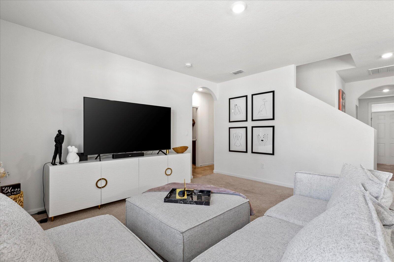 1671 Saxton Road Cocoa, FL 32926 - Photo 18 of 39 a living room with furniture and a flat screen tv