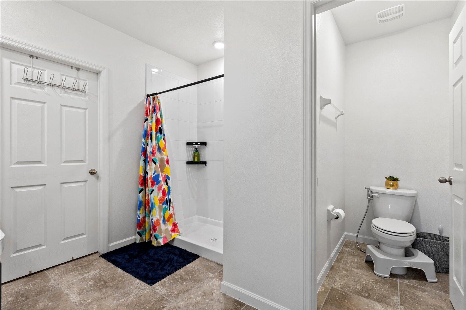 1671 Saxton Road Cocoa, FL 32926 - Photo 23 of 39 a bathroom with a toilet and a shower