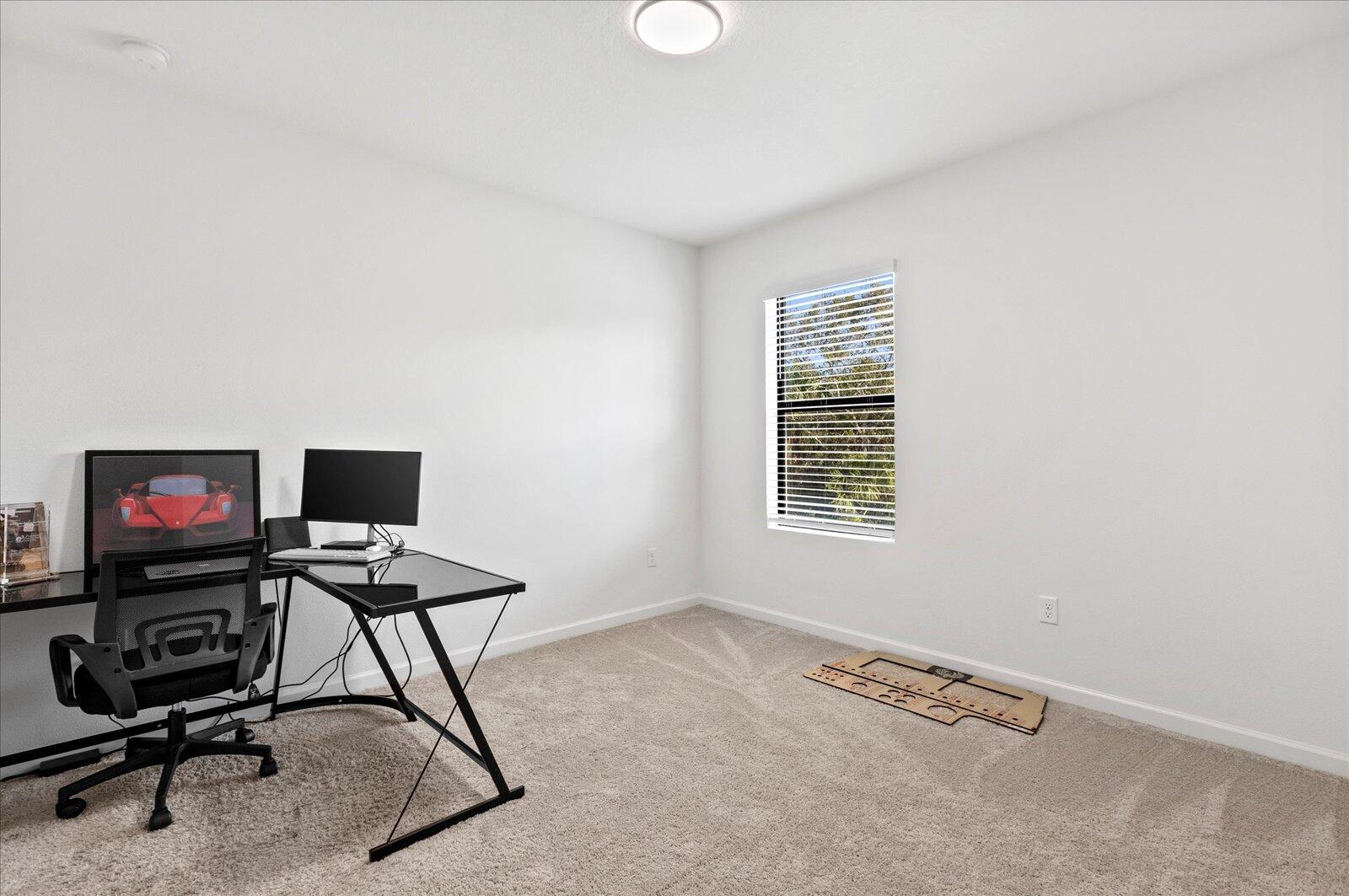 1671 Saxton Road Cocoa, FL 32926 - Photo 28 of 39 a view of a workspace with furniture and a window