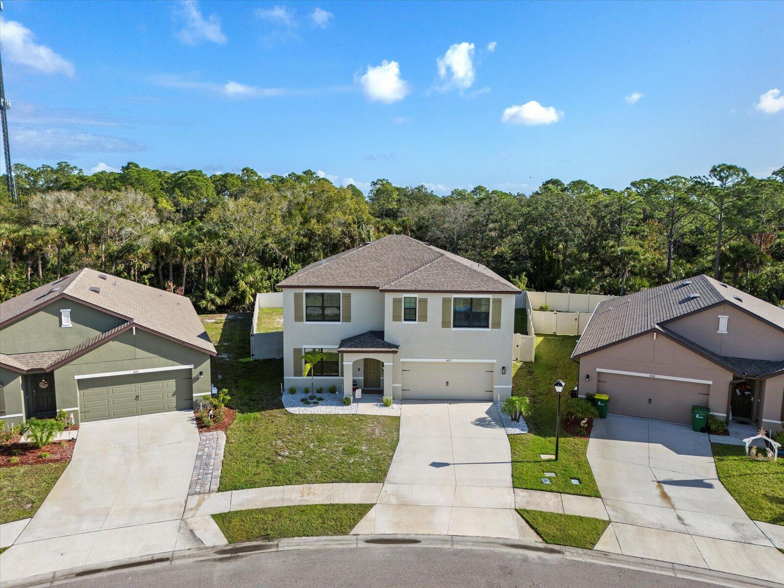 1671 Saxton Road Cocoa, FL 32926 - Photo 35 of 39 a front view of a house with a garden