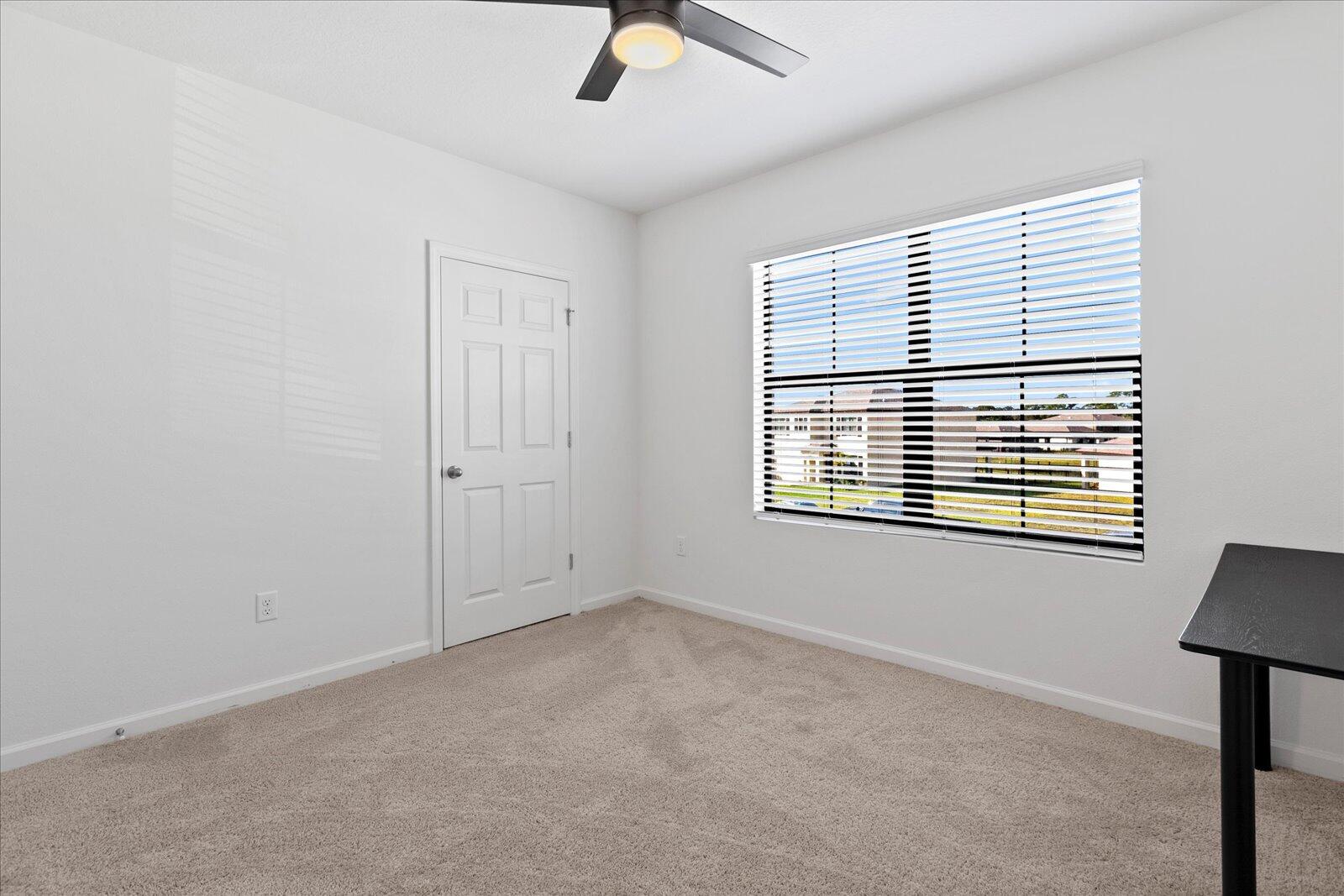 1671 Saxton Road Cocoa, FL 32926 - Photo 4 of 39 a view of an empty room with a window