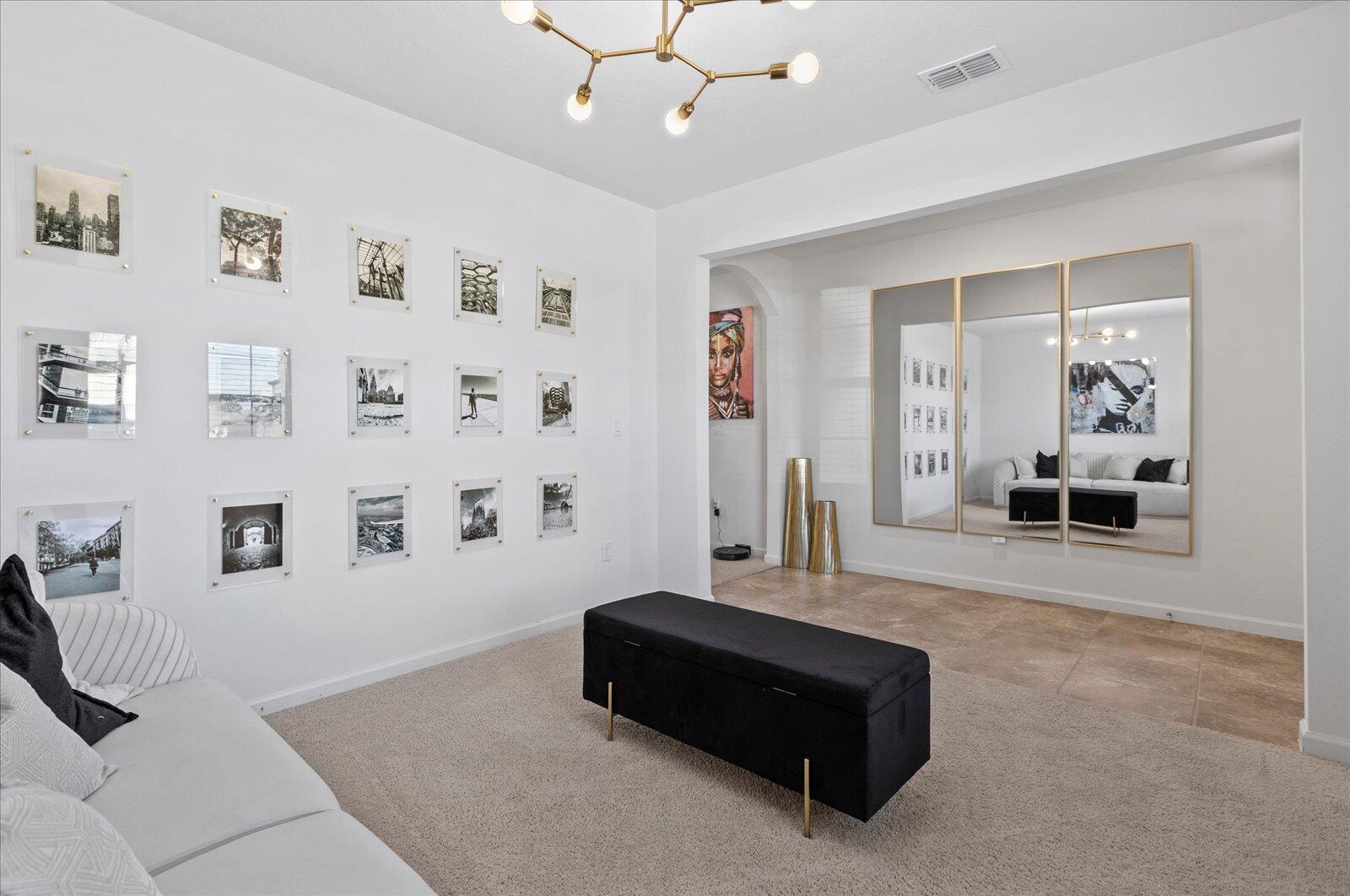1671 Saxton Road Cocoa, FL 32926 - Photo 7 of 39 a living room with furniture and a chandelier