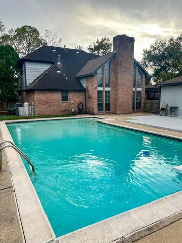 a view of a house with a yard porch and sitting area