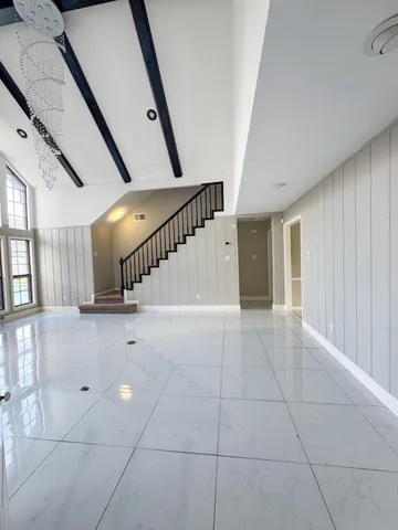 a view of an entryway with stairs