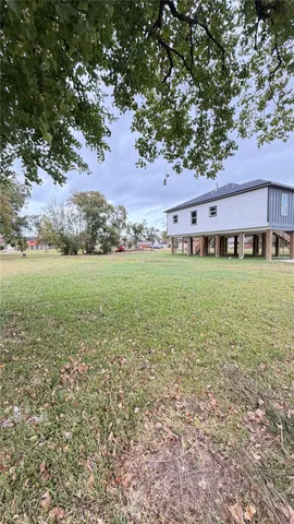 a view of a field with an trees