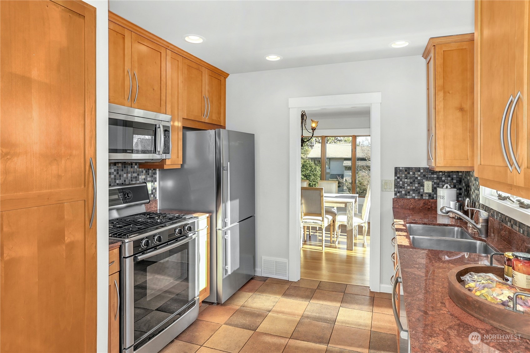 3603 Bagley Avenue North Seattle, WA 98103 - Photo 13 of 38 a kitchen with stainless steel appliances a refrigerator and a stove top oven