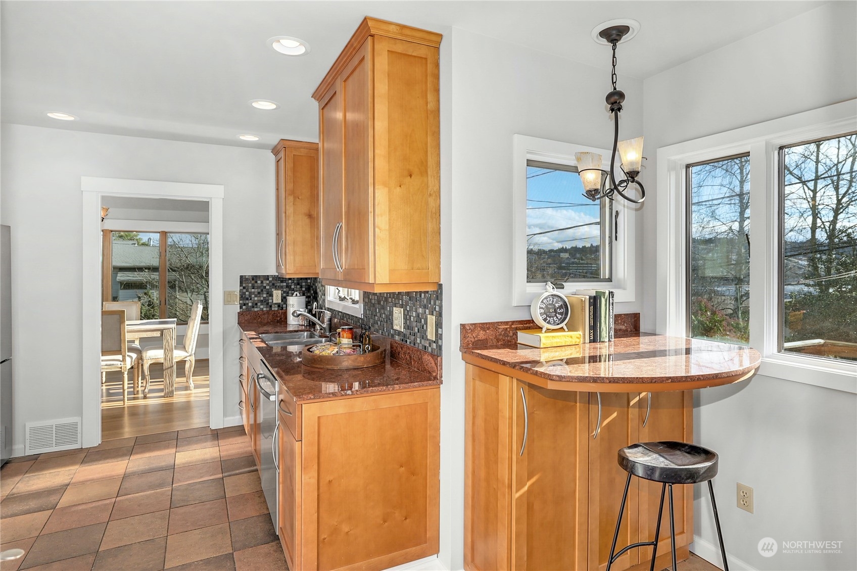 3603 Bagley Avenue North Seattle, WA 98103 - Photo 14 of 38 a dining hall with granite countertop a sink and a refrigerator