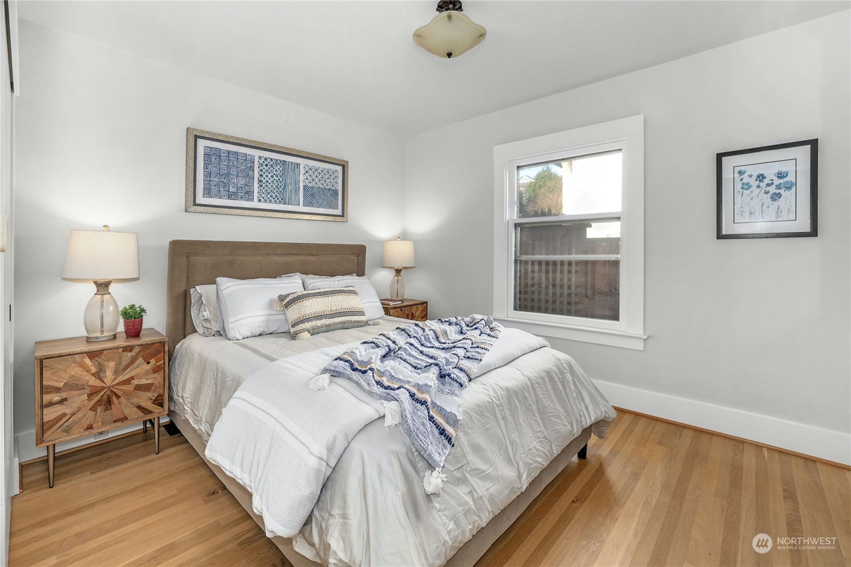 3603 Bagley Avenue North Seattle, WA 98103 - Photo 17 of 38 a bedroom with a bed and a window