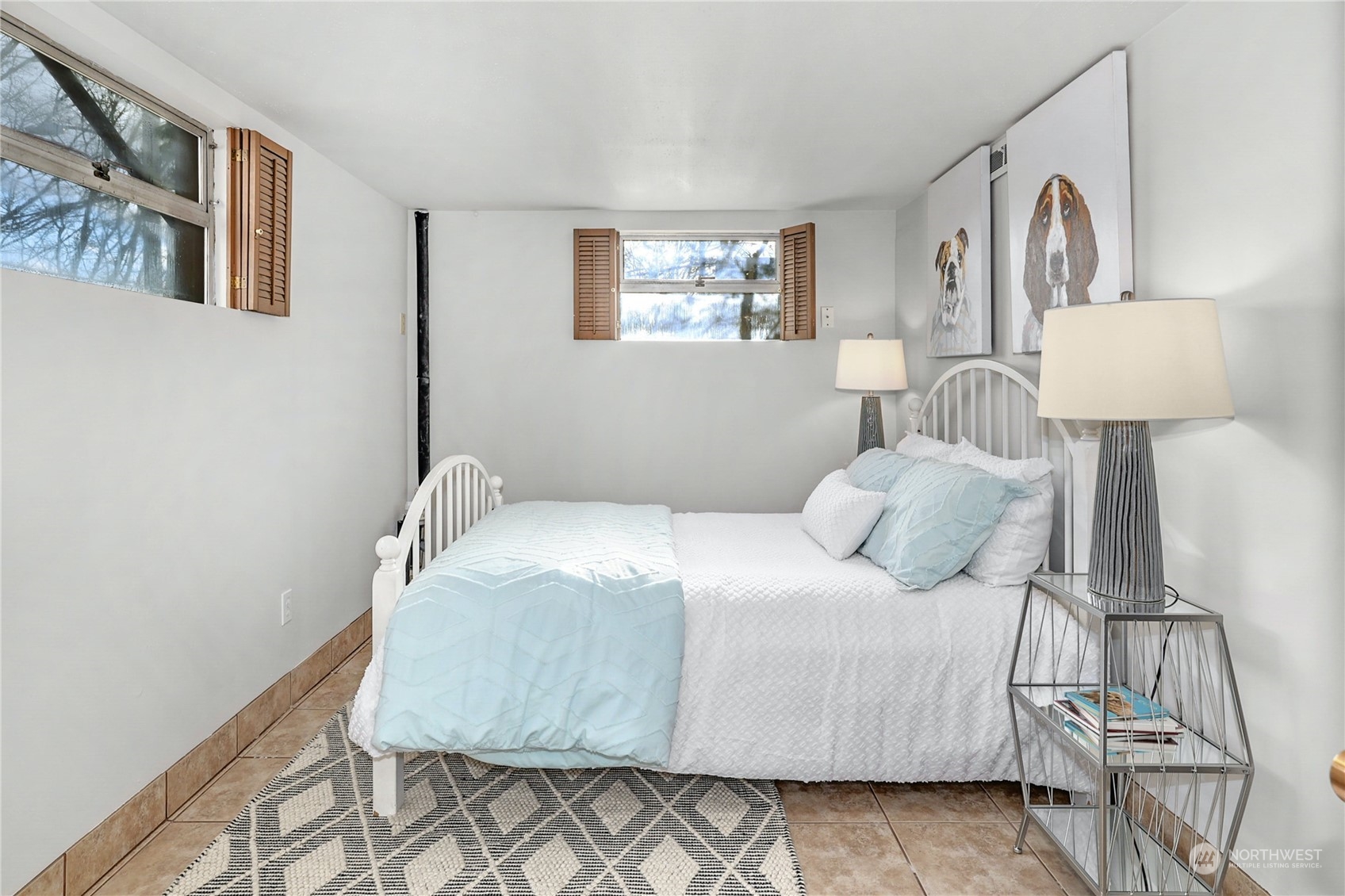 3603 Bagley Avenue North Seattle, WA 98103 - Photo 19 of 38 a bedroom with a bed and a night stand