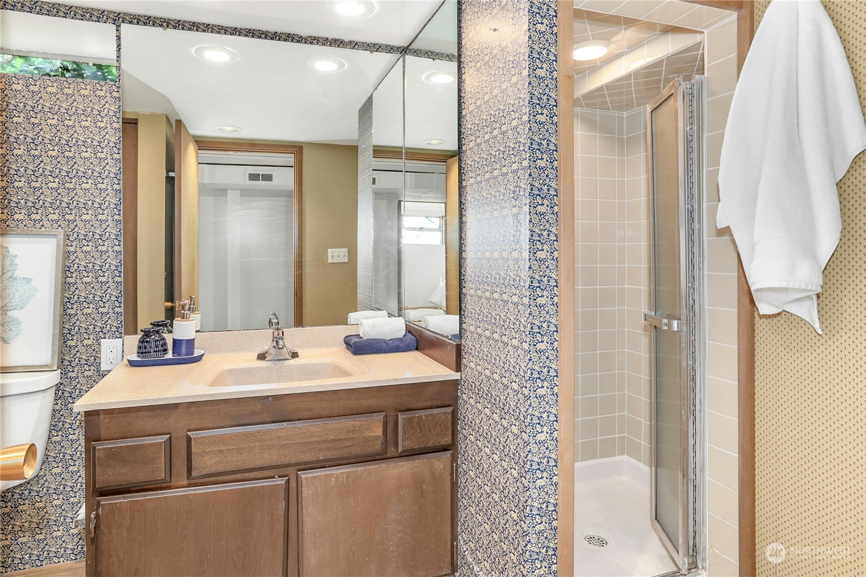 3603 Bagley Avenue North Seattle, WA 98103 - Photo 23 of 38 a bathroom with a sink a mirror and a shower