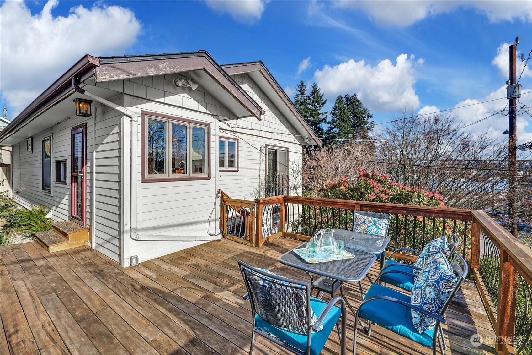 3603 Bagley Avenue North Seattle, WA 98103 - Photo 27 of 38 a roof deck with wooden floor and fence