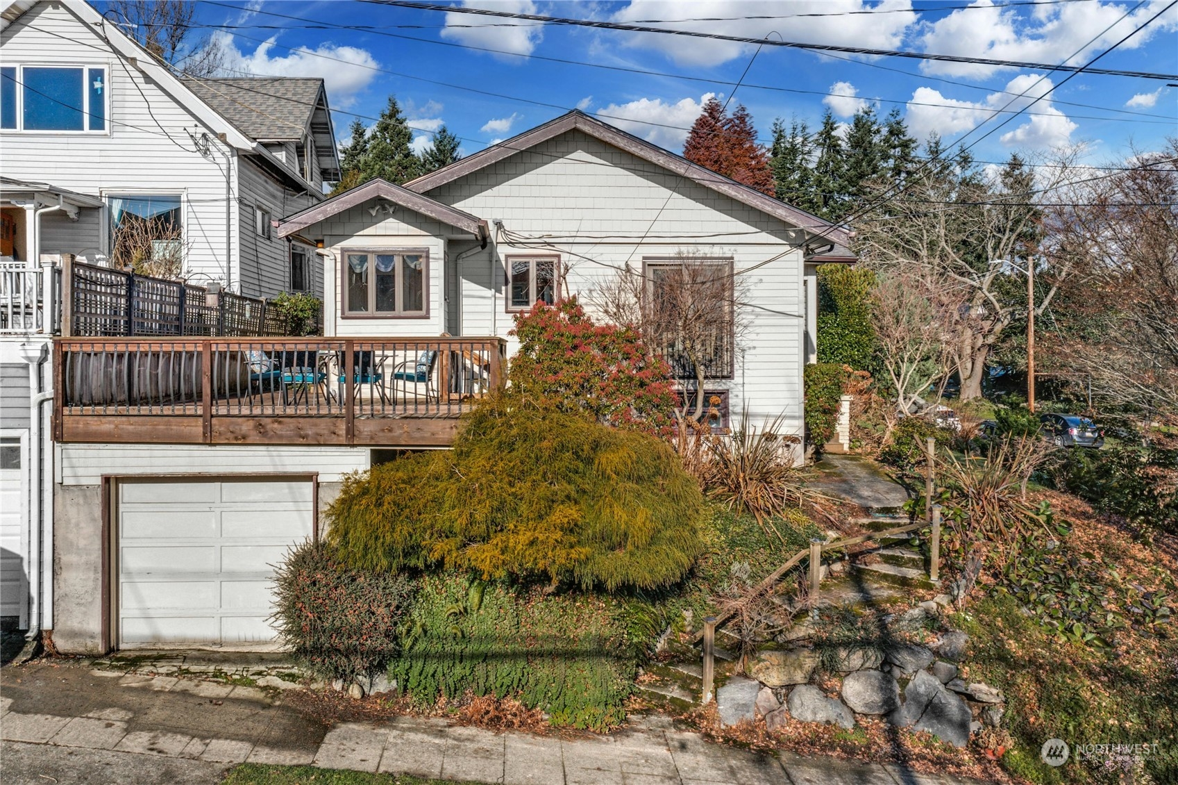 3603 Bagley Avenue North Seattle, WA 98103 - Photo 3 of 38 a front view of a house with a garden