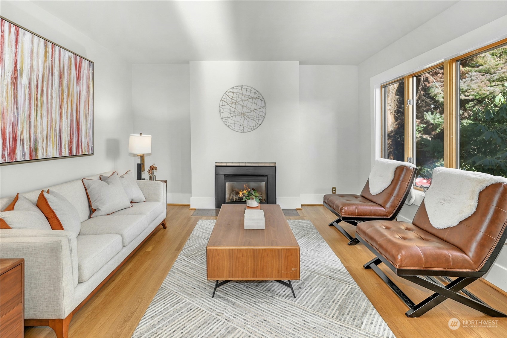 3603 Bagley Avenue North Seattle, WA 98103 - Photo 7 of 38 a living room with furniture a large window and a fireplace