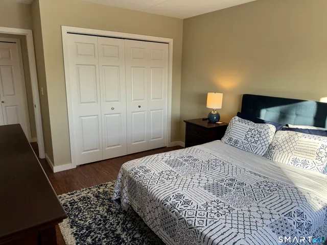 a bedroom with a bed and a walk in closet