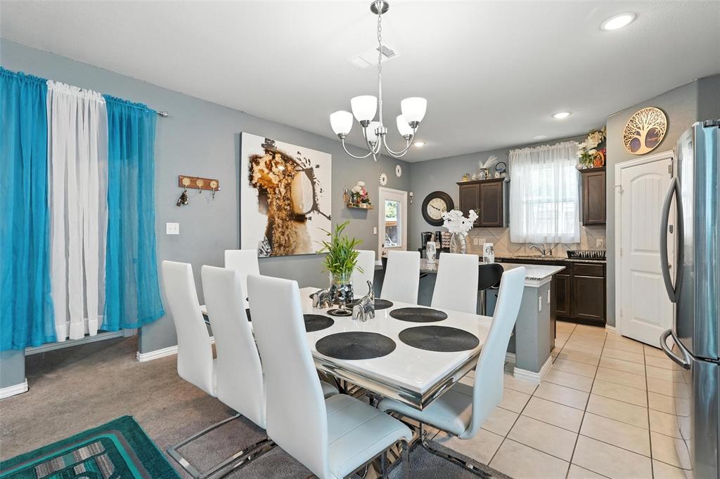 314 Frank Street Terrell, TX 75160 - Photo 11 of 40 a view of a dining room with furniture and a chandelier