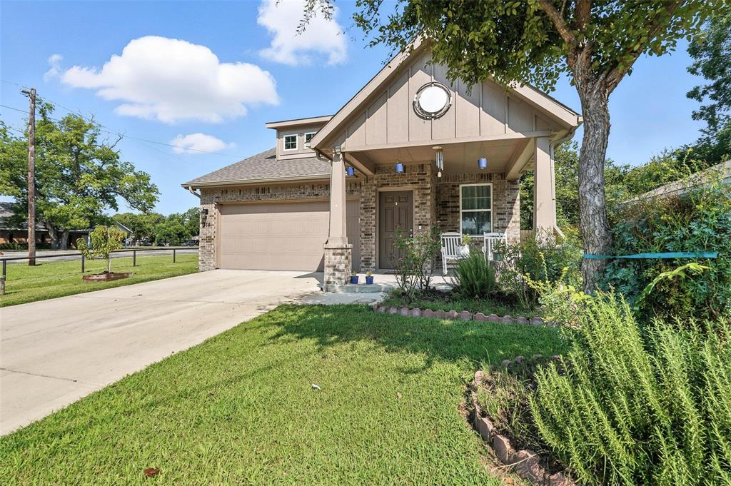 314 Frank Street Terrell, TX 75160 - Photo 2 of 40 a front view of a house with a yard and garage