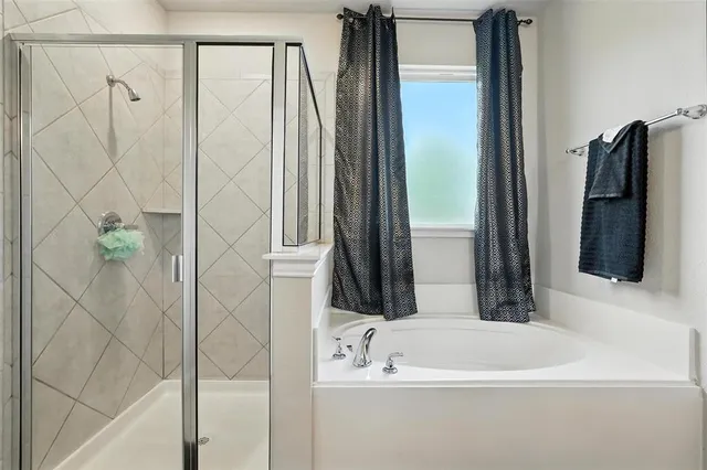 a bathroom with a sink a mirror and a bathtub