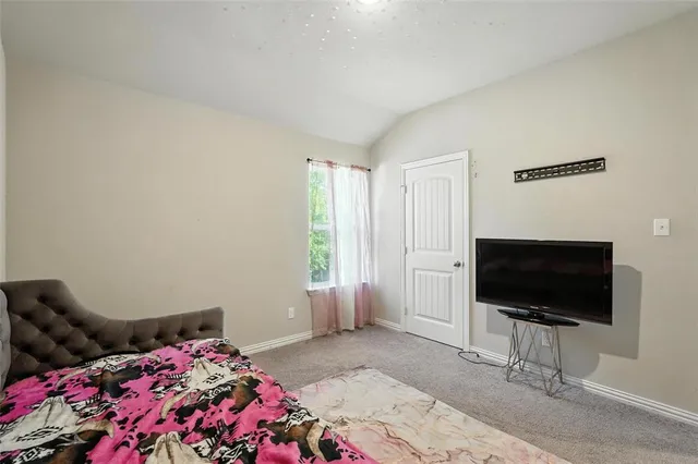 a bath room with a bed and a window