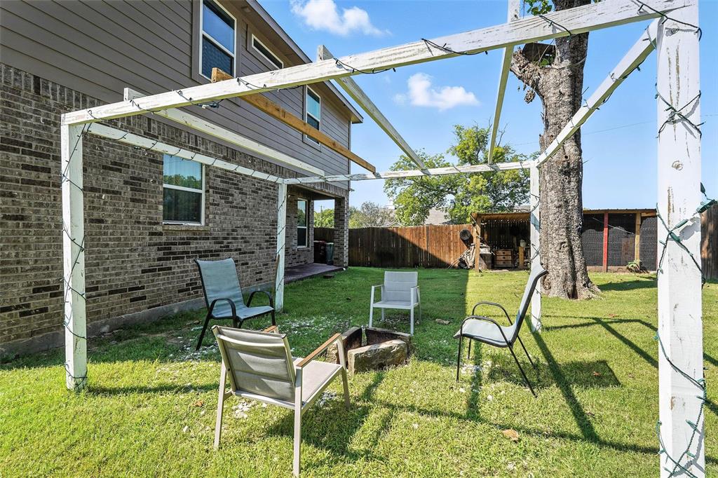 314 Frank Street Terrell, TX 75160 - Photo 38 of 40 a view of a chair and table in backyard of the house