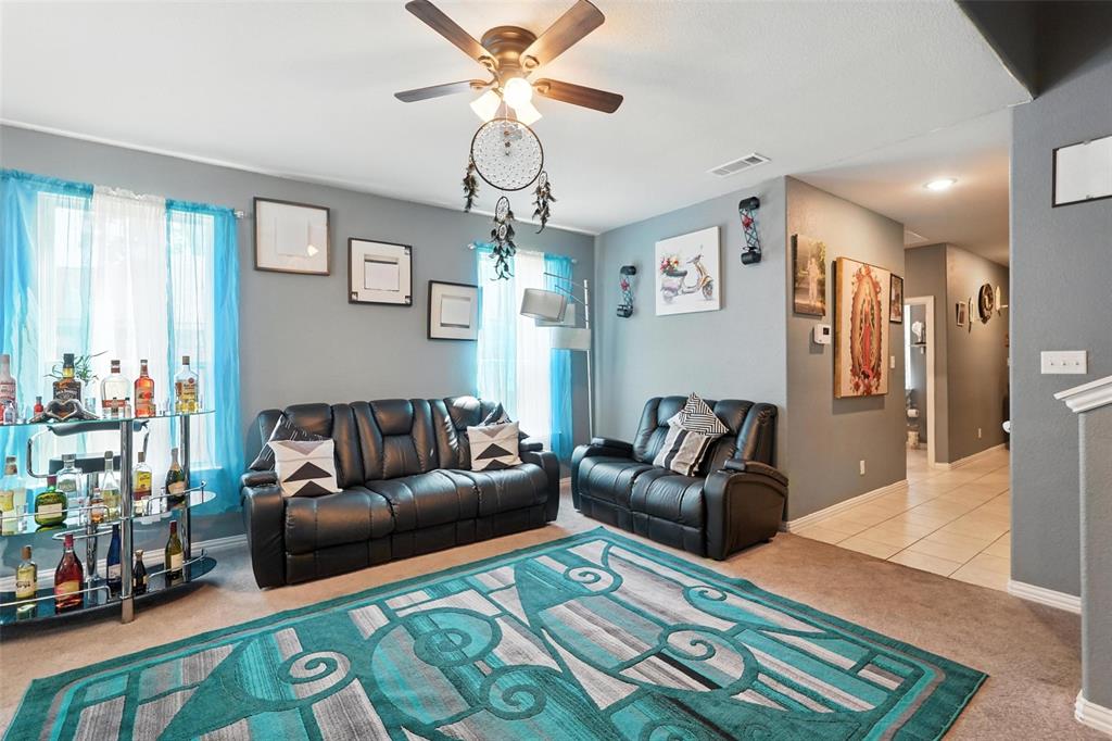 314 Frank Street Terrell, TX 75160 - Photo 8 of 40 a living room with furniture and a chandelier