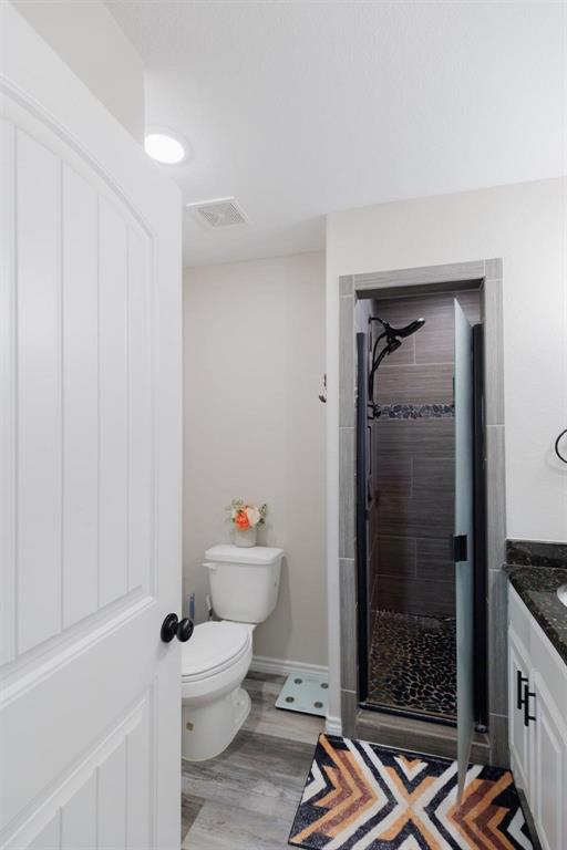 8615 North Fm 51 Decatur, TX 76234 - Photo 21 of 26 a bathroom with a toilet a sink and shower