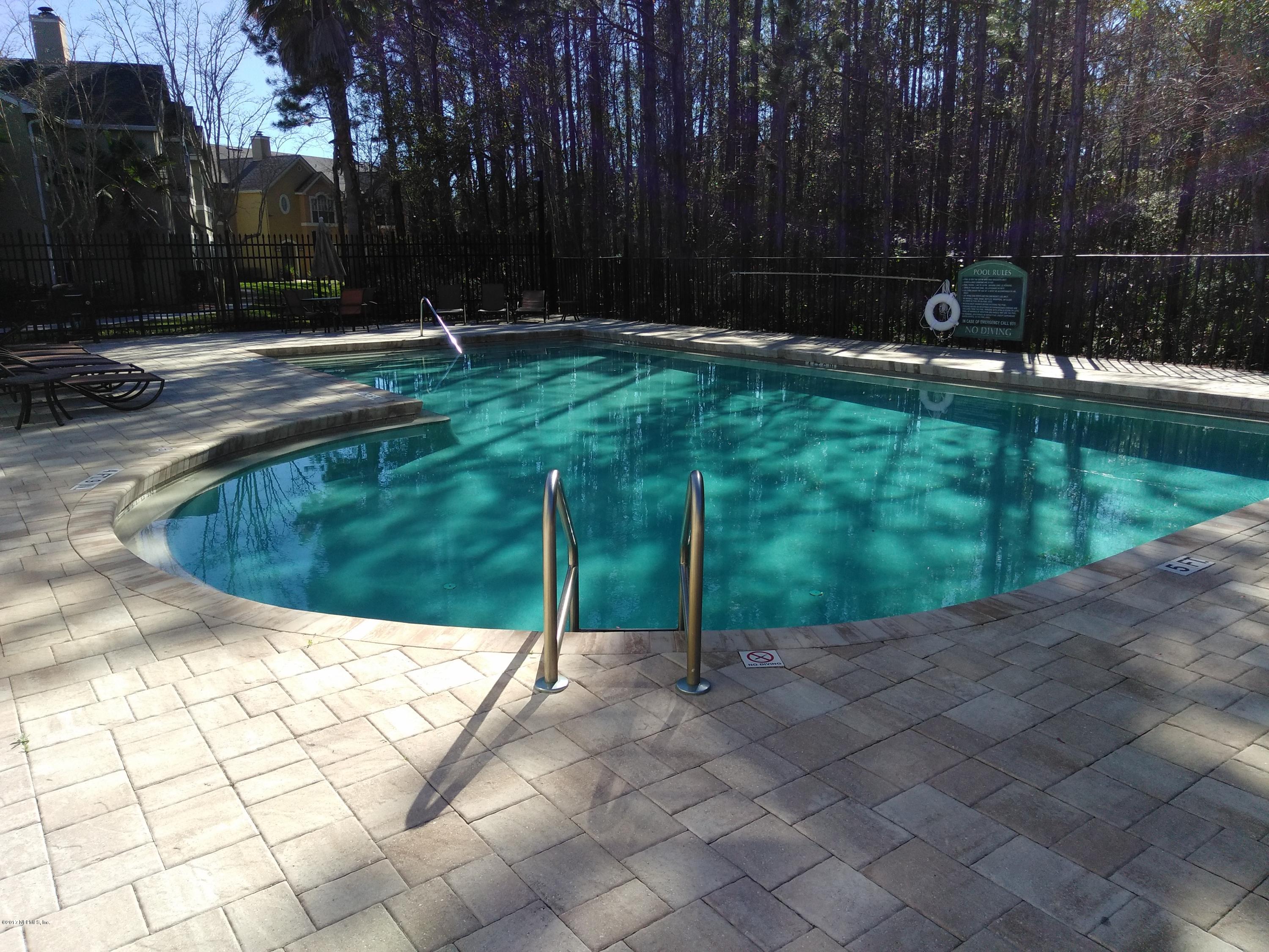 1717 County Road 220, Unit 1908 Fleming Island, FL 32003 - Photo 11 of 12 a view of a backyard
