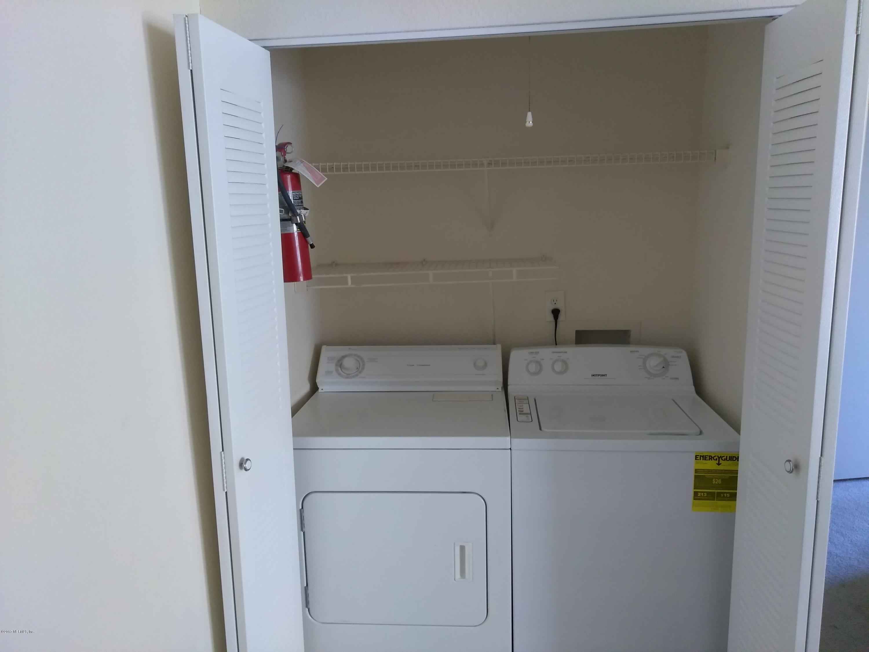 1717 County Road 220, Unit 1908 Fleming Island, FL 32003 - Photo 7 of 12 a utility room with dryer and washer