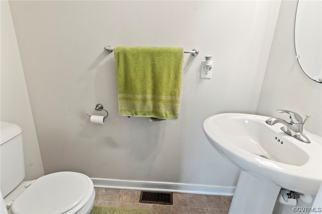 3800 Benton Avenue Richmond, VA 23222 - Photo 11 of 26 a bathroom with a sink and a mirror