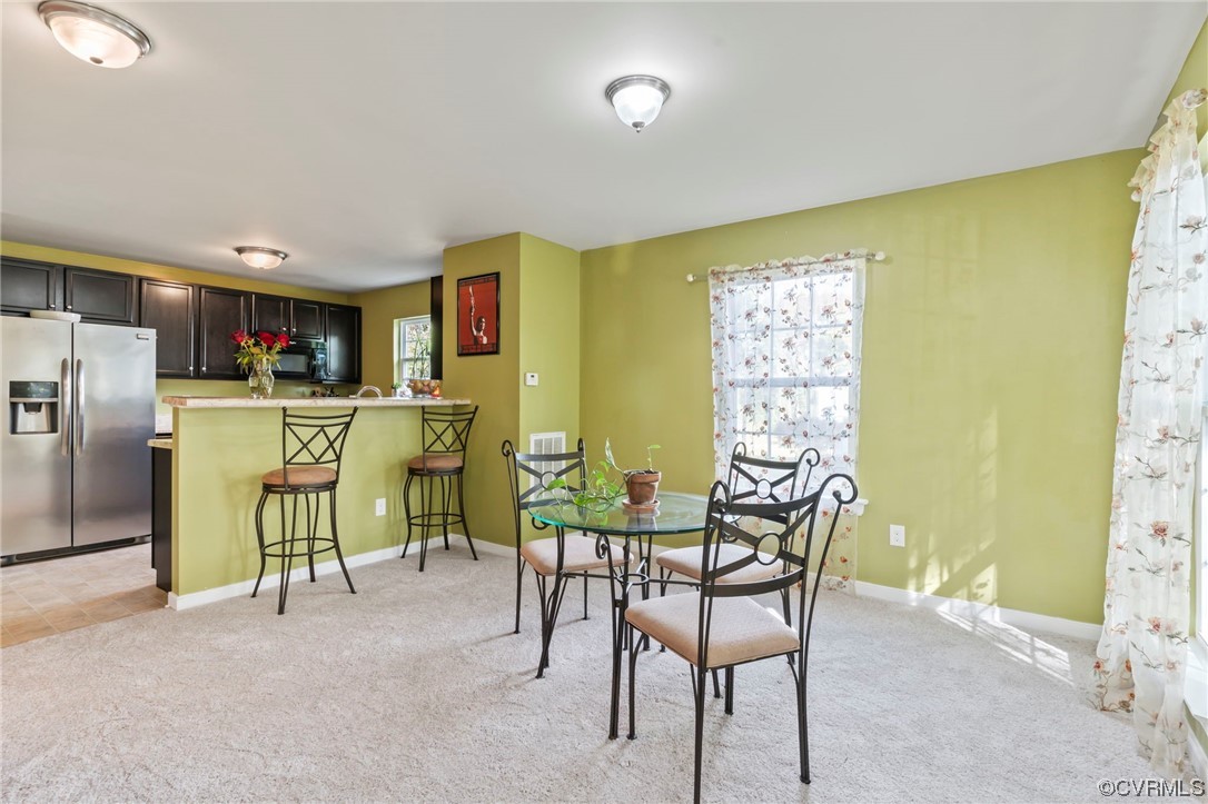 3800 Benton Avenue Richmond, VA 23222 - Photo 5 of 26 a dining room with furniture and a kitchen view