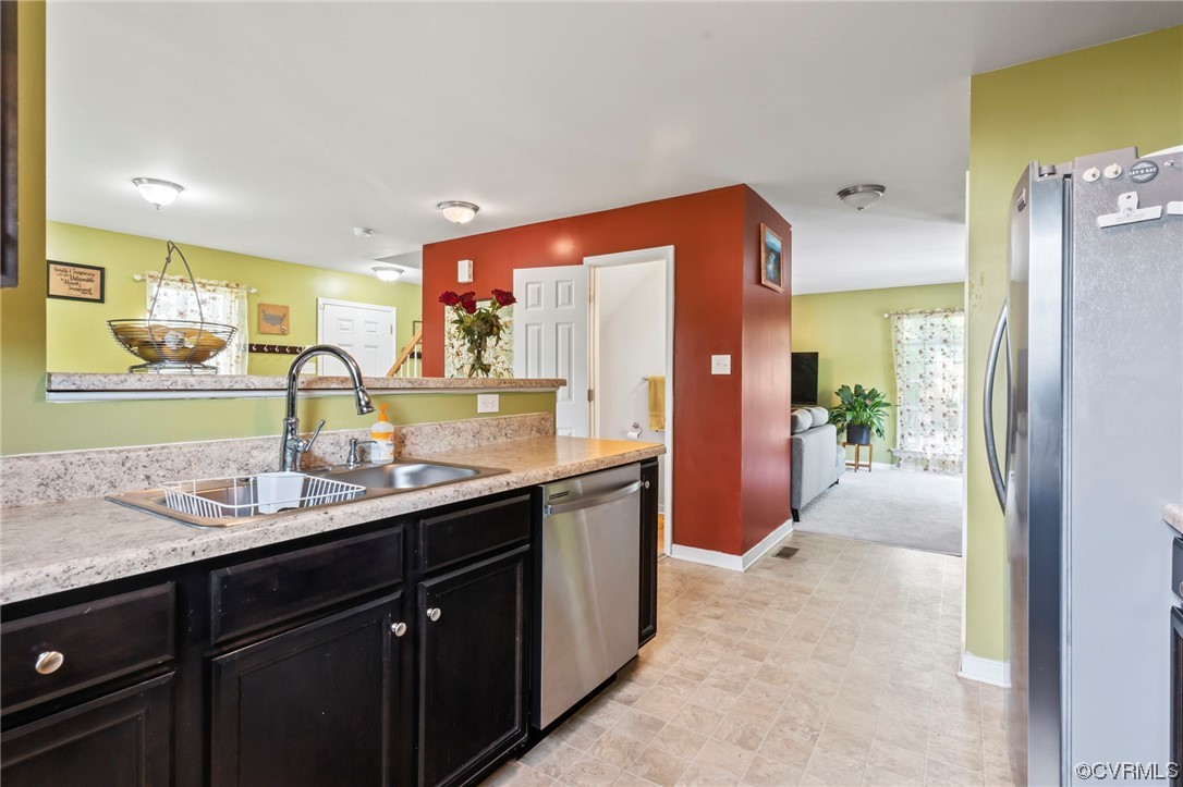 3800 Benton Avenue Richmond, VA 23222 - Photo 7 of 26 a bathroom with a double vanity sink and a mirror