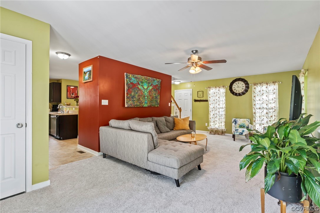 3800 Benton Avenue Richmond, VA 23222 - Photo 8 of 26 a living room with furniture a chandelier and a window