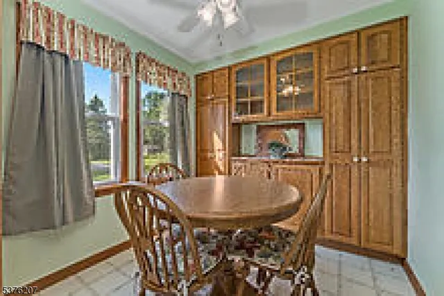 a dining room with furniture window wooden floor and front door