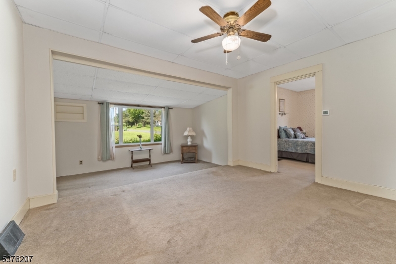 6 Franklin Street Washington, NJ 07882 - Photo 18 of 38 a view of a livingroom with a window and a ceiling fan