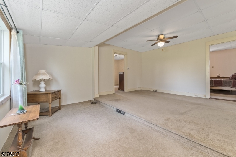 6 Franklin Street Washington, NJ 07882 - Photo 20 of 38 a view of empty room with cabinet and wooden floor
