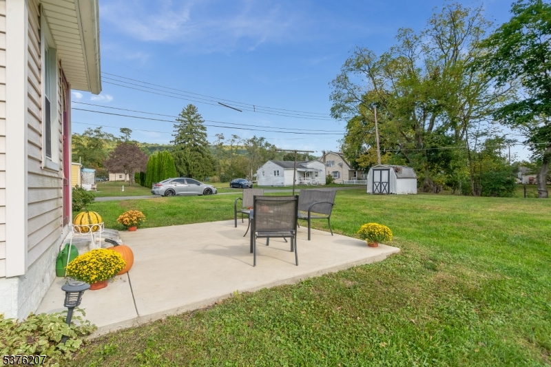 6 Franklin Street Washington, NJ 07882 - Photo 37 of 38 a view of a garden with a table and chairs