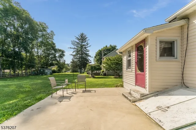a view of backyard with green space