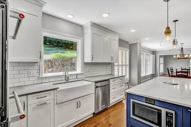 a kitchen with a stove a sink and a refrigerator
