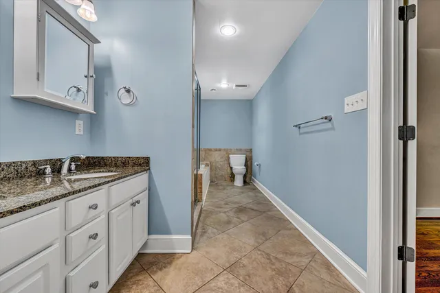 a bathroom with a bathtub and a toilet