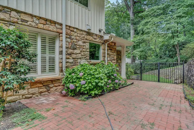 a view of a pathway both side of house
