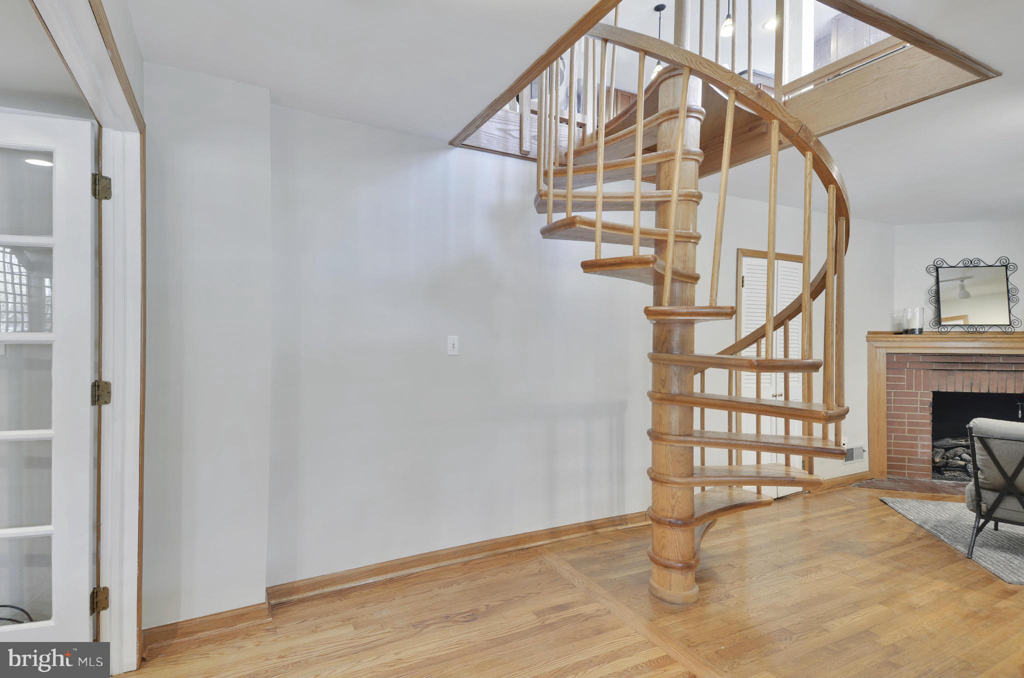 5223 Wyoming Road Bethesda, MD 20816 - Photo 24 of 30 Foyer view to spiral stair and Rec Room