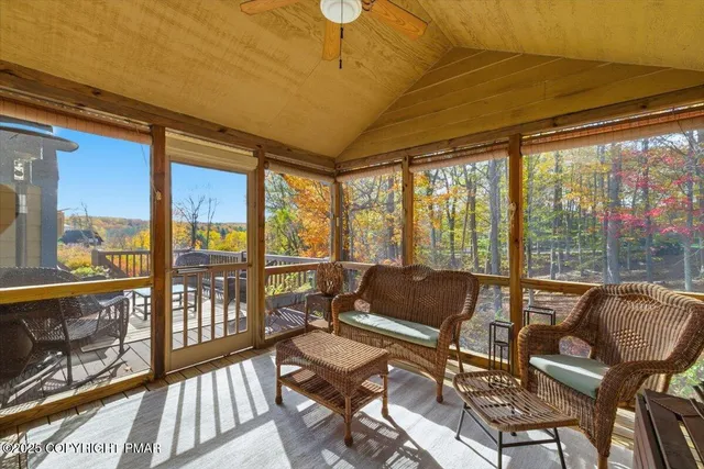 a view of a hallway with entryway wooden floor and front door