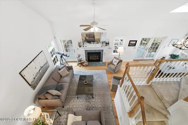 an aerial view of a house with a yard